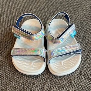 Iridescent silver Native toddler sandals.